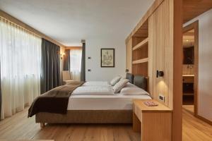 Postel nebo postele na pokoji v ubytování Residence Mugun