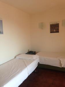 Posteľ alebo postele v izbe v ubytovaní Residenza Chrysalis Bay
