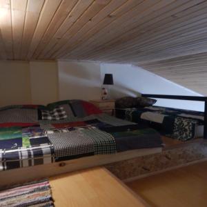 a bedroom with two beds in a attic at Room 46 in Gudauri