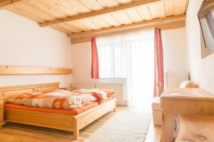Tempat tidur dalam kamar di Landgasthof Seyrlberg