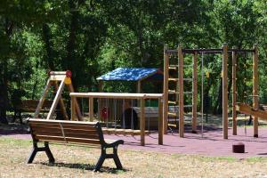a park with a playground with a slide at Masseria Calandrella in Noci