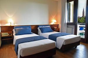 Postel nebo postele na pokoji v ubytování Hotel Bellavista
