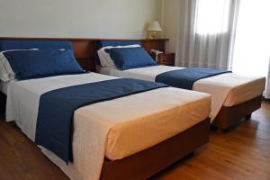 Postel nebo postele na pokoji v ubytování Hotel Bellavista