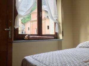 A bed or beds in a room at Da Duccio e Maria