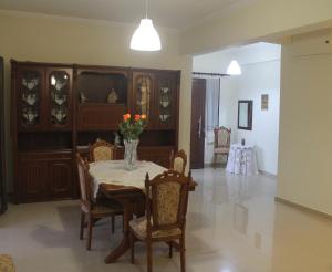 a dining room with a table and chairs at Villa Bene in Preveza