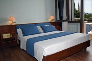 Postel nebo postele na pokoji v ubytování Hotel Bellavista