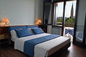 Postel nebo postele na pokoji v ubytování Hotel Bellavista