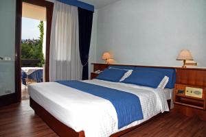 Postel nebo postele na pokoji v ubytování Hotel Bellavista