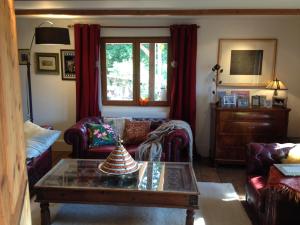 a living room with a couch and a coffee table at Chalet Ingas in Troistorrents +26 photos