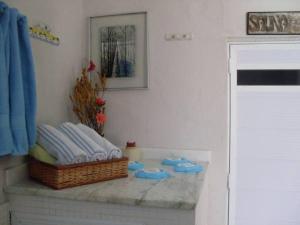 a bathroom with a counter with towels on it at Pousada Boulevard in Cabo Frio +75 photos