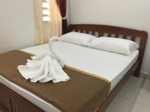 A bed or beds in a room at Ana Guest House Jalan Airport Kuantan