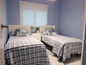 Postel nebo postele na pokoji v ubytování Sweet Caroline Apartment