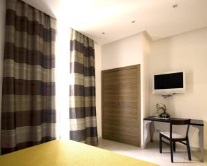 Televízia a/alebo spoločenská miestnosť v ubytovaní Interno 5 B&B