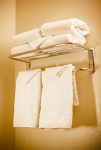 a towel rack with towels on a wall at Natura Treescape Resort in Wisconsin Dells