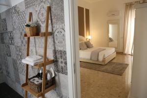 a room with a bed and a toilet in it at Dimi House in Lecce
