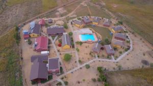 an overhead view of a house yard with a pool at HOTEL H1 ISALO in Ranohira
