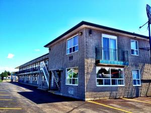 a large brick building with a lot of windows at Angus Inn Motel in Angus