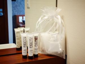 a group of three tubes of hair products sitting on a counter at S.Training Center Hotel Osaka in Osaka