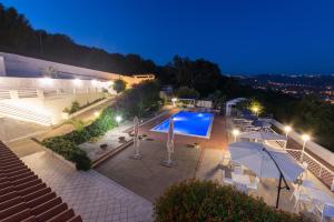 an overhead view of a swimming pool at night at Villa Milena in Agropoli