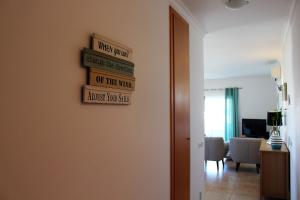 Телевизор и/или развлекательный центр в Âncora Boutique Apartments