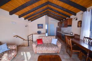 a living room with a couch and a table at Kazanegra Exclusive Apartments in Sveti Stefan