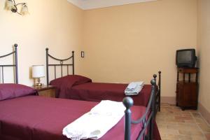 A bed or beds in a room at Villa del Cardinale