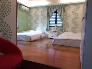 Rúm í herbergi á Tai Yu Ju Bao Fang B&B