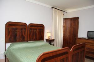 A bed or beds in a room at Villa del Cardinale
