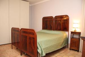 A bed or beds in a room at Villa del Cardinale