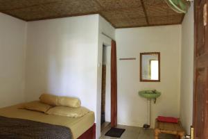 Ένα ή περισσότερα κρεβάτια σε δωμάτιο στο Defa Homestay