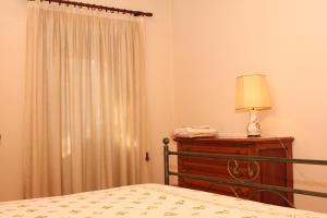 A bed or beds in a room at Villa del Cardinale