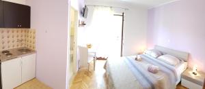 Postel nebo postele na pokoji v ubytování Apartments Milatic