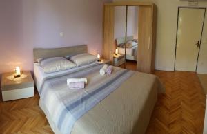 Postel nebo postele na pokoji v ubytování Apartments Milatic