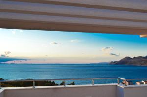 a view of the ocean from a balcony at Villa Dobre Vode in Dobra Voda
