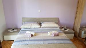 Postel nebo postele na pokoji v ubytování Apartments Milatic