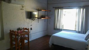 Ένα ή περισσότερα κρεβάτια σε δωμάτιο στο Cabañas Las Victorias