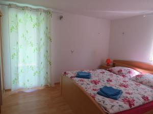 A bed or beds in a room at Apartma Patricija - cozy apartments