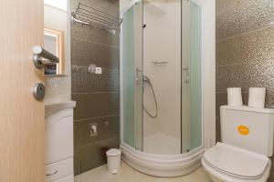 a bathroom with a toilet and a shower at Apartments Villa-Ines Center in Vodice +30 photos