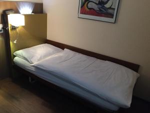 Postel nebo postele na pokoji v ubytování Zys Hotel + 25 fotografií