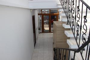 a hallway with stairs and a door to a building at MIMOZA - Apartaments Panoramic Sea View in Eforie Nord