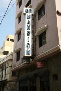 a hotel sign on the side of a building at GP Mansion in Chennai