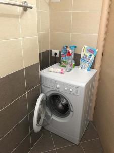 a washing machine in the corner of a bathroom at Radhima Beach Apartment-Tirana Resort in Orikum