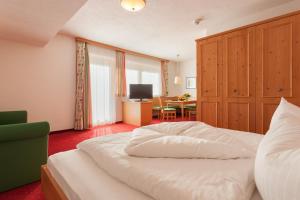 Postel nebo postele na pokoji v ubytování Hotel Augarten