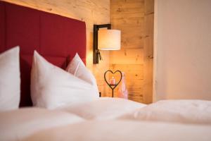 Postel nebo postele na pokoji v ubytování Hotel Augarten