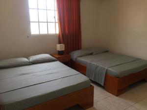 מיטה או מיטות בחדר ב-Apartamentos Rocky Cay Bay
