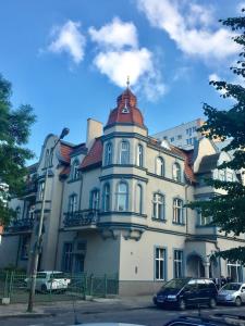 a large building with a tower on top of it at Kwatera Prywatna Maja in Sopot +53 photos