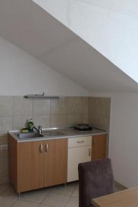 a kitchen with a sink and a counter top at Villa Nestor in Struga