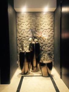 two black and white vases in a room at Hotel MUSE in Sankt Pölten