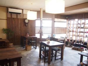 a restaurant with tables and chairs in a room at Ichie in Tanabe +32 photos