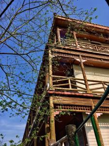 a tall building with a window on the side of it at Wan Ruey Resort in Hengshan